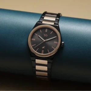 Men’s black and gold wristwatch with minimalist dial and metal strap